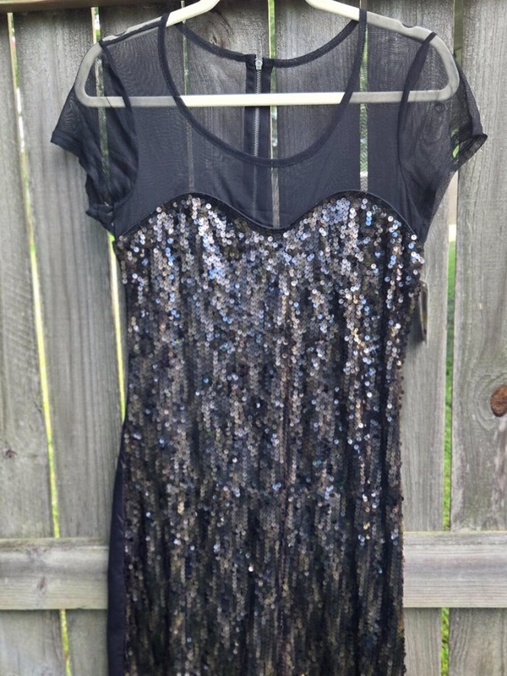 Sequin mini dress with shear yoke. Imitation Neckline.  The rest is Sequins! Med